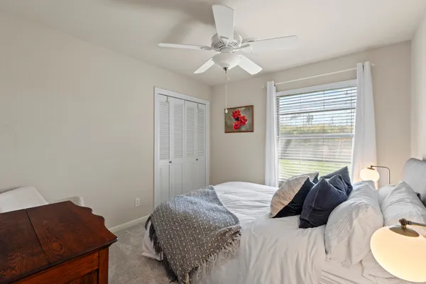 a view of a storage & utility room with closet wooden floor