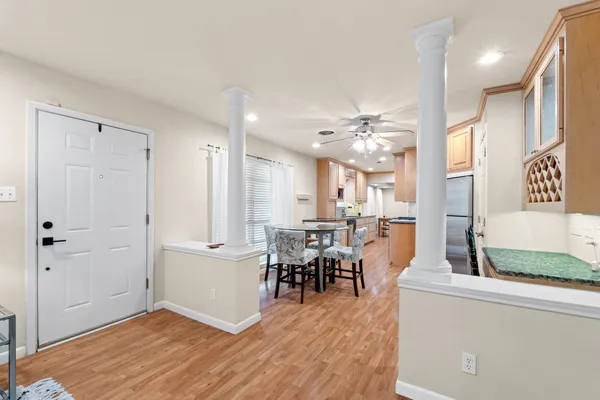 a view of a dining room with furniture and wooden floor