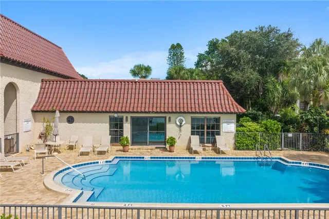 a view of swimming pool with seating space