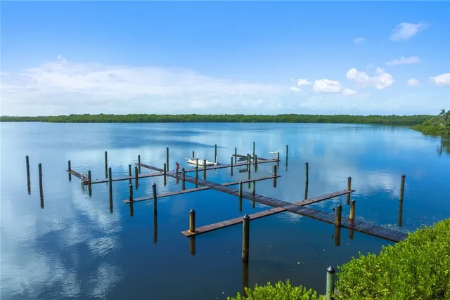 a view of a lake with sitting area