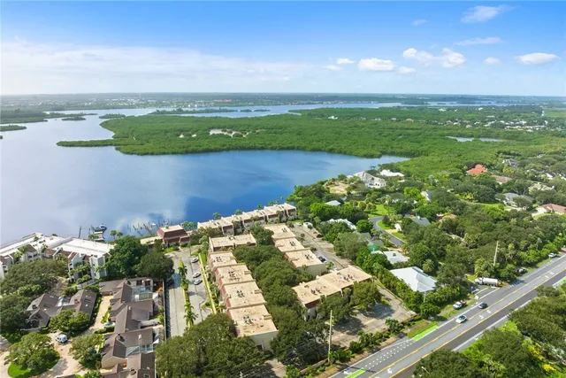an aerial view of a houses with a lake view