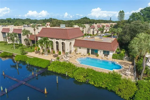 a view of a house with a yard and patio