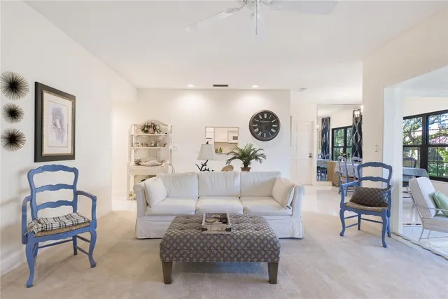 a living room with furniture and a chair