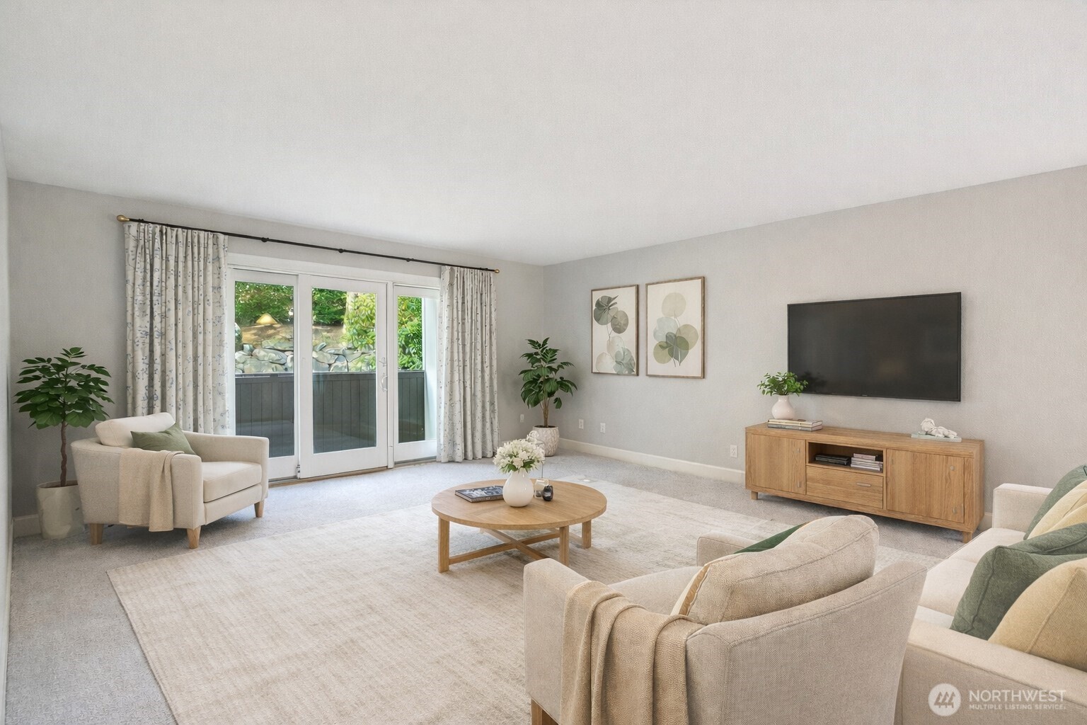 a living room with furniture and a flat screen tv