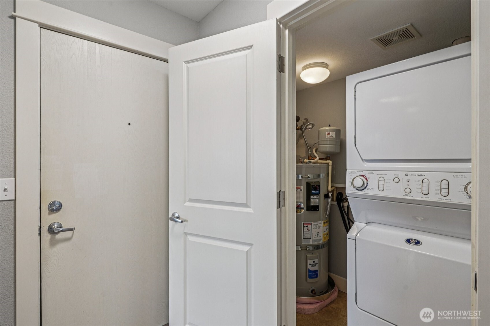 8025 234th Street Southwest, Unit 116 Edmonds, WA 98026 - Photo 13 of 26 a view of a storage and utility room with a washer and dryer