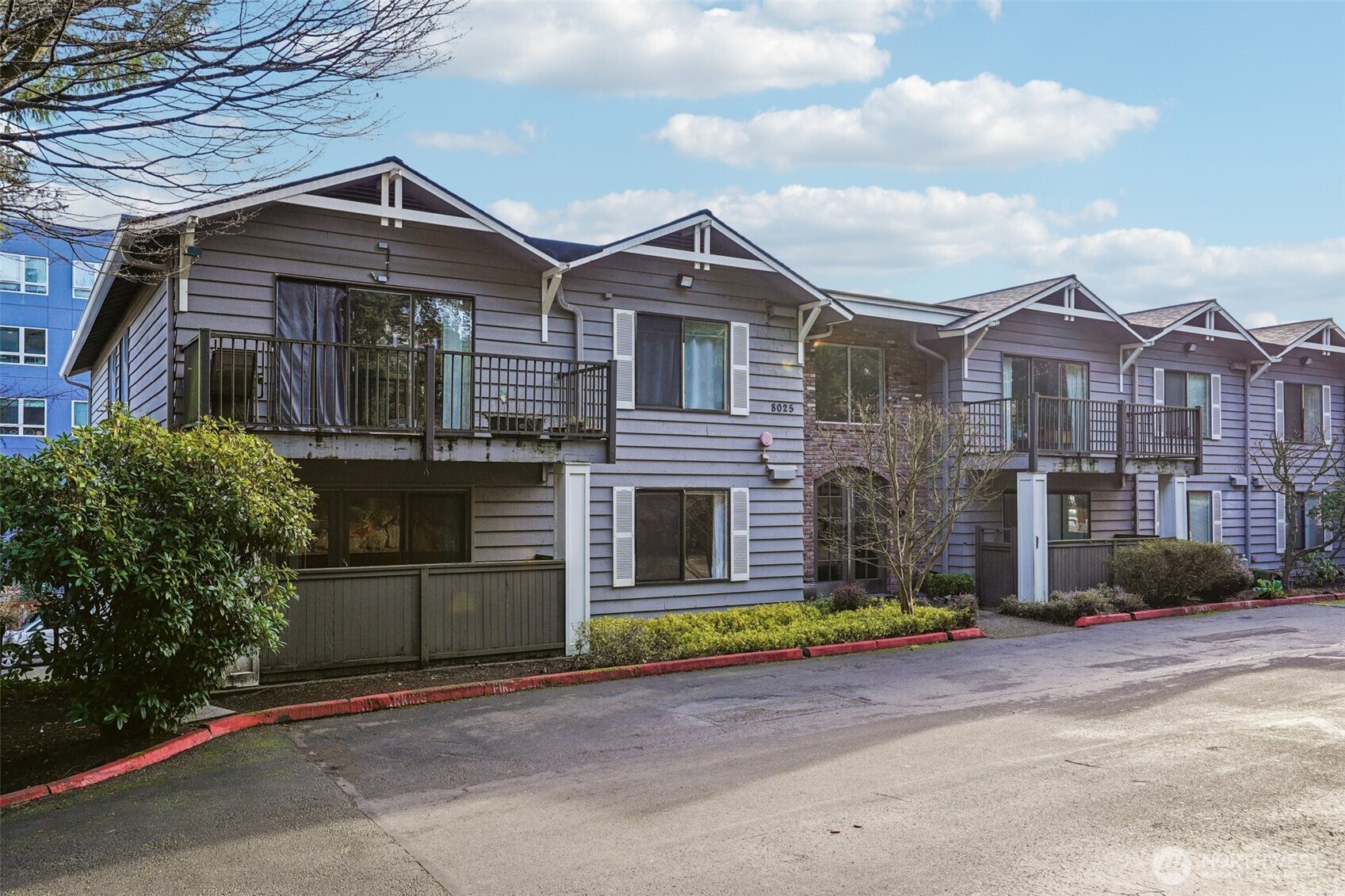 8025 234th Street Southwest, Unit 116 Edmonds, WA 98026 - Photo 16 of 26 a front view of a house with a yard