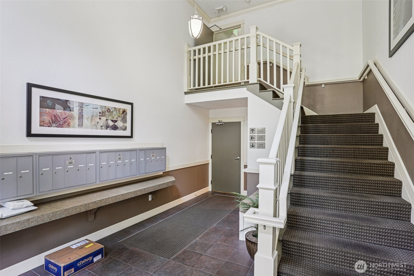 8025 234th Street Southwest, Unit 116 Edmonds, WA 98026 - Photo 20 of 26 a view of staircase with white walls and stairs