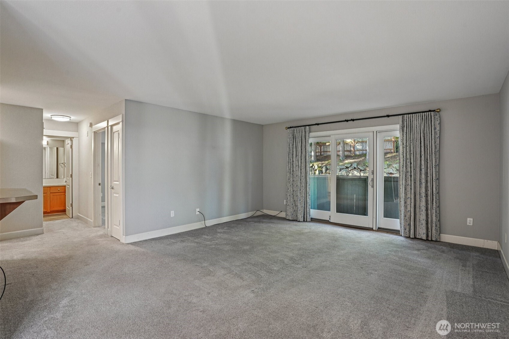 8025 234th Street Southwest, Unit 116 Edmonds, WA 98026 - Photo 2 of 26 a view of an empty room with a window