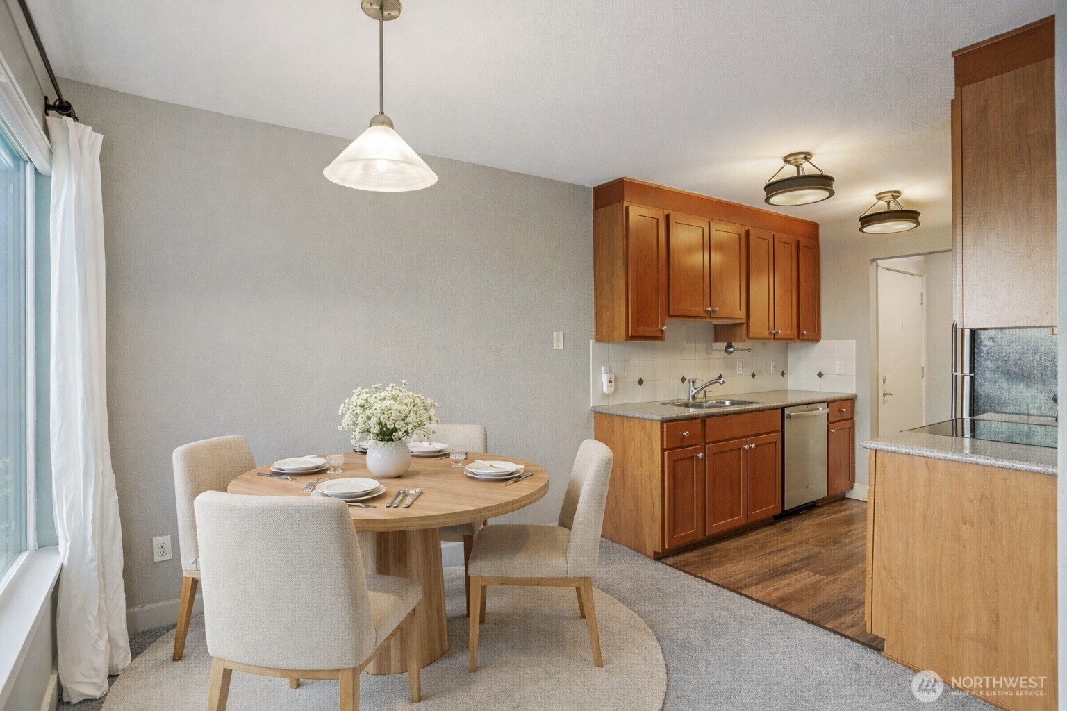 8025 234th Street Southwest, Unit 116 Edmonds, WA 98026 - Photo 5 of 26 a bathroom with a sink and a mirror
