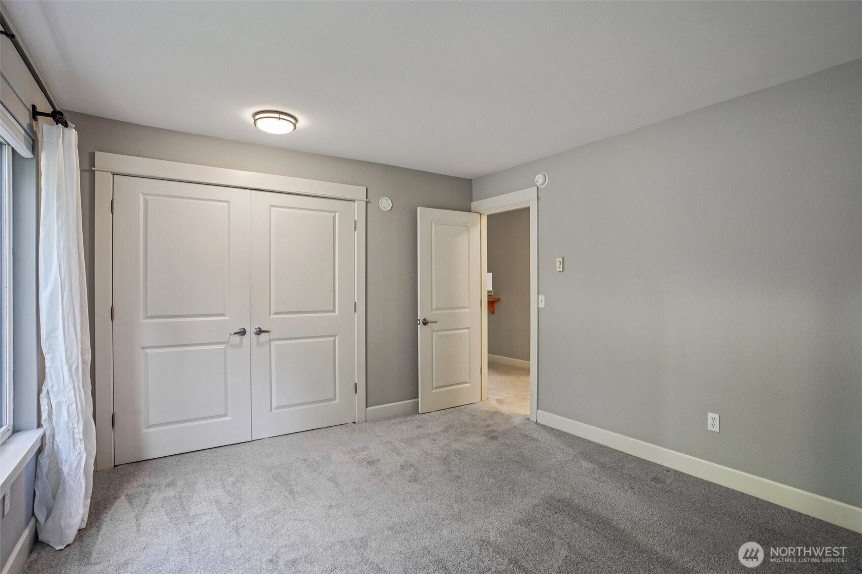 8025 234th Street Southwest, Unit 116 Edmonds, WA 98026 - Photo 10 of 26 a view of an empty room