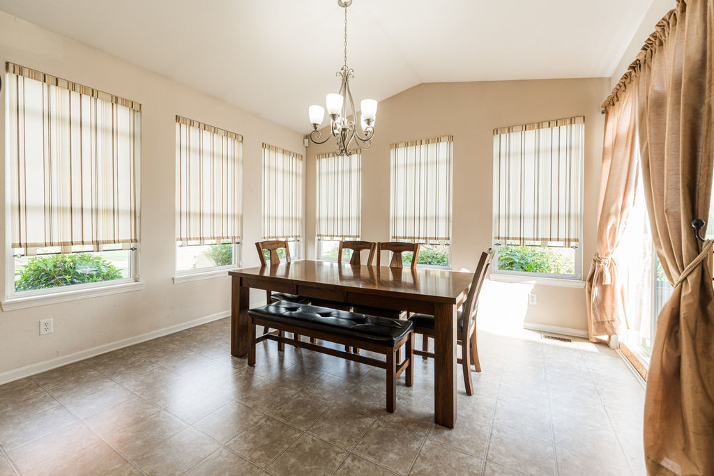 508 Winding Trail Genoa, IL 60135 - Photo 14 of 41 a view of a dining room with furniture window and wooden floor