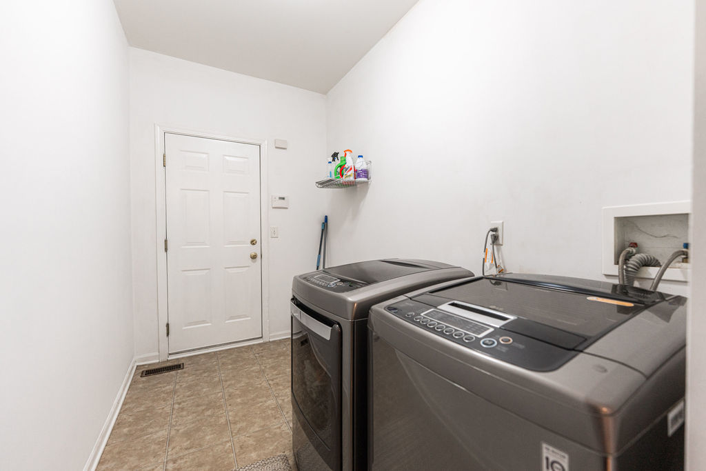 508 Winding Trail Genoa, IL 60135 - Photo 19 of 41 a utility room with dryer and washer