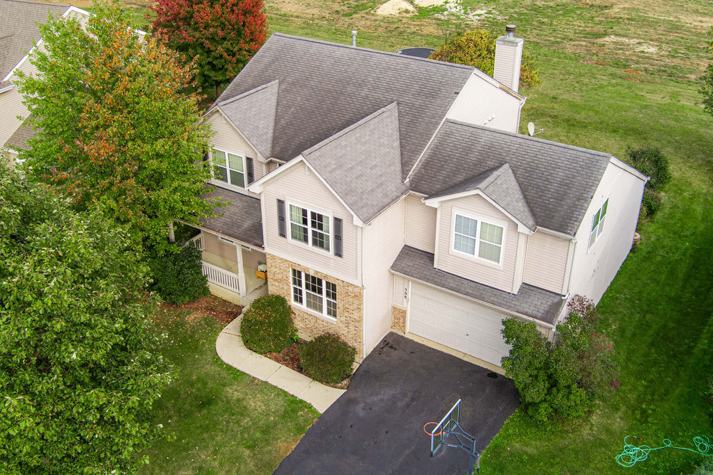 508 Winding Trail Genoa, IL 60135 - Photo 2 of 41 a view of a house with a yard potted plants