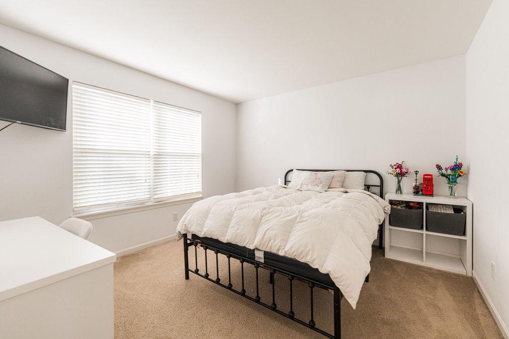 508 Winding Trail Genoa, IL 60135 - Photo 26 of 41 a bedroom with a bed and a flat tv screen on dresser