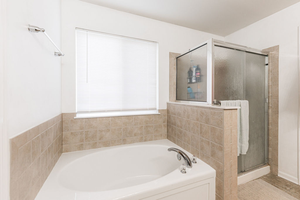 508 Winding Trail Genoa, IL 60135 - Photo 32 of 41 a bathroom with a bathtub and a shower