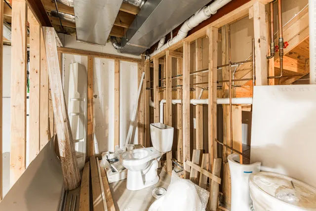 a bathroom with a bathtub and shower