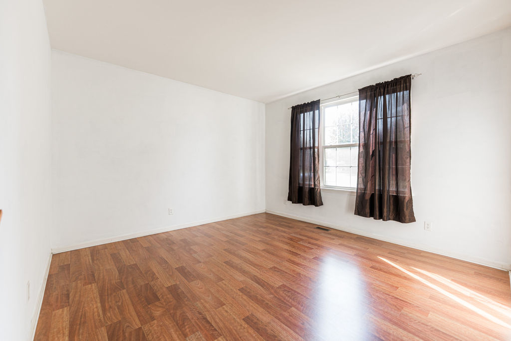 508 Winding Trail Genoa, IL 60135 - Photo 7 of 41 an empty room with wooden floor and windows