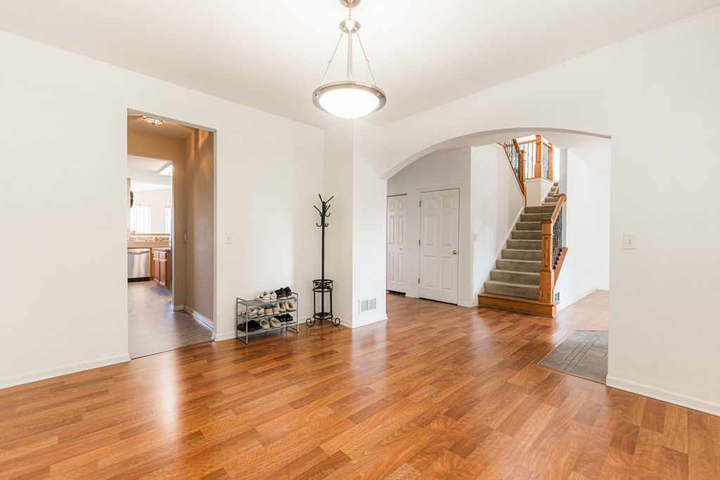 508 Winding Trail Genoa, IL 60135 - Photo 10 of 41 wooden floor in an empty room with a window