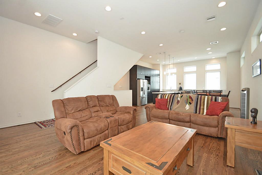 2713 Clay Street Houston, TX 77003 - Photo 12 of 24 This view shows the great open space of the living area. Half bath is located in front of the stairs.