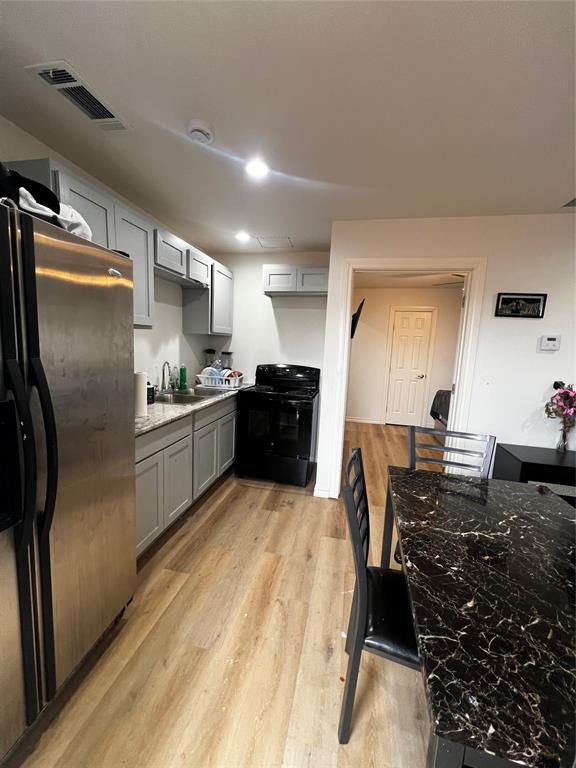 1410 Doyle Avenue Dallas, TX 75203 - Photo 9 of 10 kitchen 2 in the back with a room and additional bath