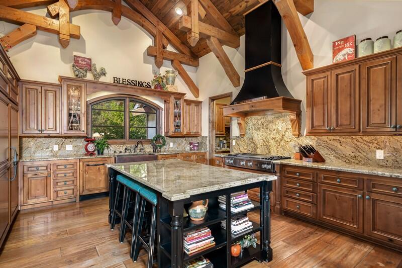 35650 Pyramid Peak Road Mountain Center, CA 92561 - Photo 15 of 58 a view of a kitchen area with furniture and wooden floor