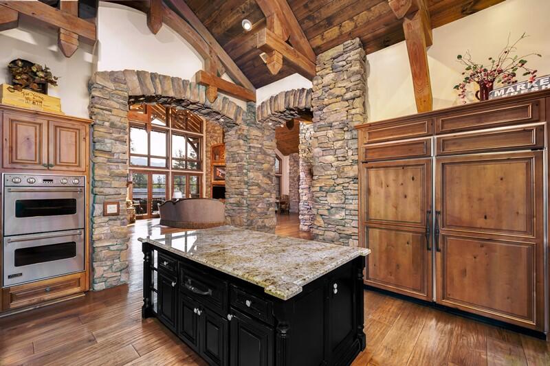 35650 Pyramid Peak Road Mountain Center, CA 92561 - Photo 18 of 58 a kitchen view of a kitchen island wooden floor and stainless steel appliances