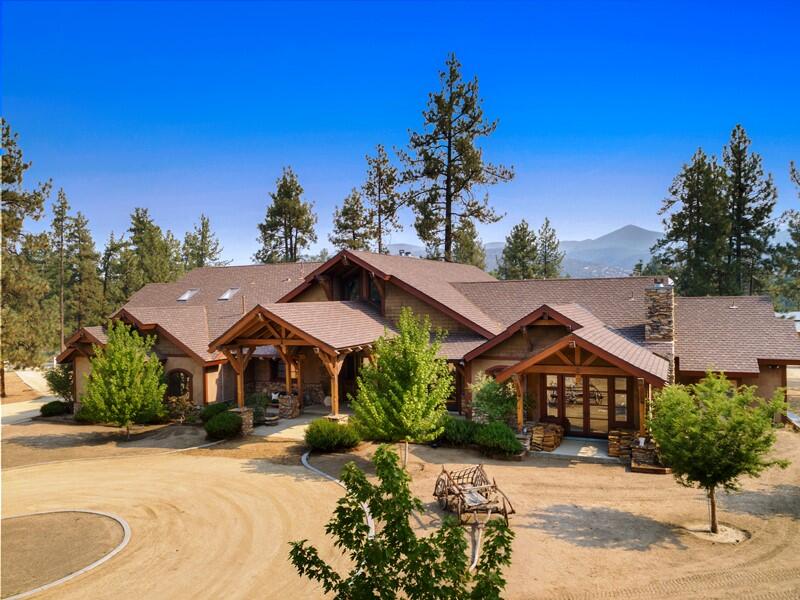 35650 Pyramid Peak Road Mountain Center, CA 92561 - Photo 3 of 58 a front view of a house with a yard