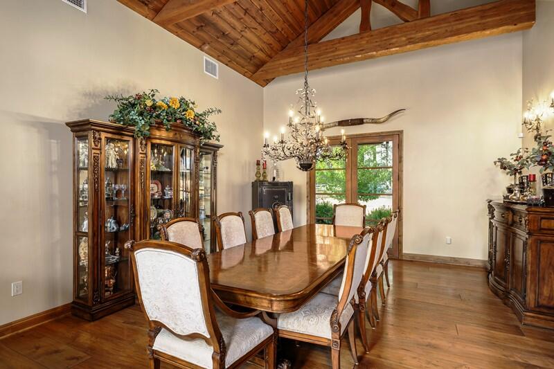 35650 Pyramid Peak Road Mountain Center, CA 92561 - Photo 22 of 58 a dining room with furniture a chandelier and wooden floor