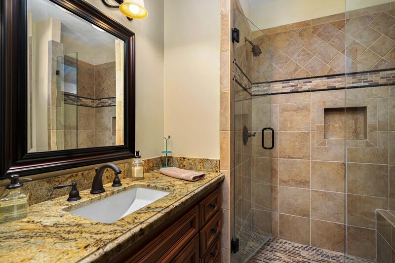 35650 Pyramid Peak Road Mountain Center, CA 92561 - Photo 31 of 58 a bathroom with a granite countertop sink a mirror and shower