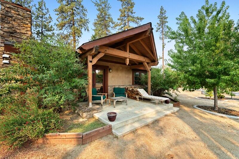 35650 Pyramid Peak Road Mountain Center, CA 92561 - Photo 39 of 58 a view of a patio with a table and chairs under an umbrella