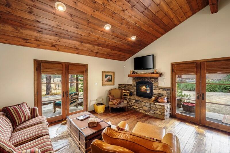 35650 Pyramid Peak Road Mountain Center, CA 92561 - Photo 40 of 58 a living room with furniture large window and a fireplace