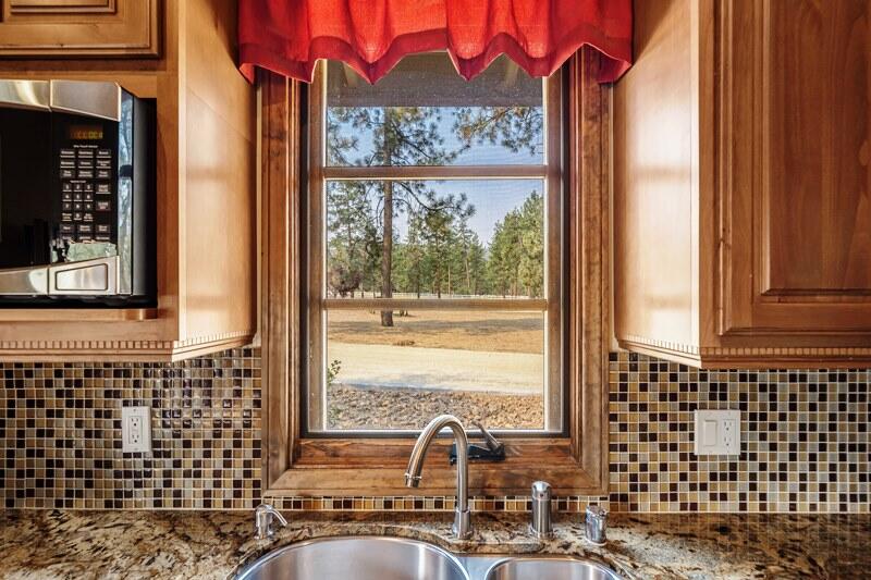 35650 Pyramid Peak Road Mountain Center, CA 92561 - Photo 42 of 58 a bathroom with a sink a mirror and next to a window