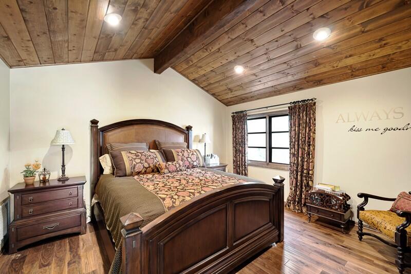 35650 Pyramid Peak Road Mountain Center, CA 92561 - Photo 44 of 58 a bedroom with a bed and wooden floor