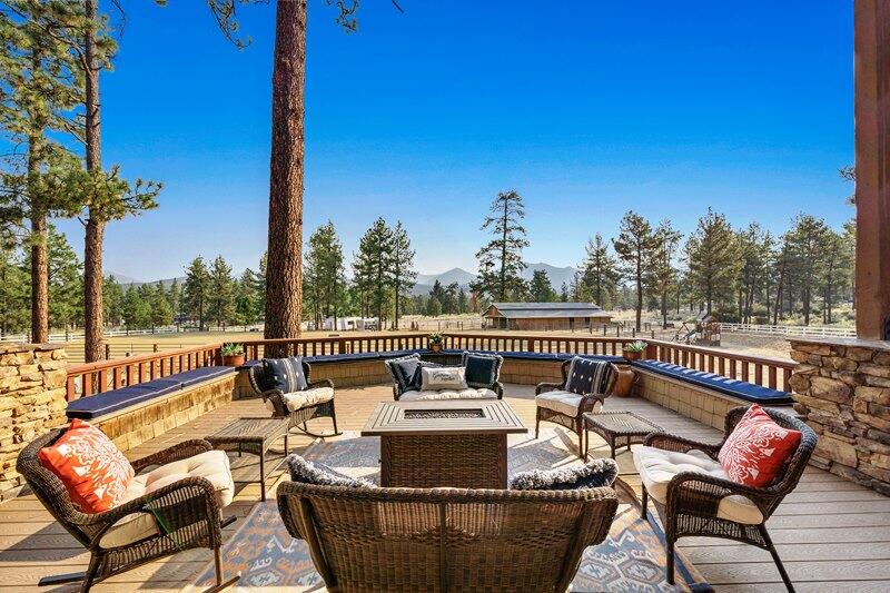 35650 Pyramid Peak Road Mountain Center, CA 92561 - Photo 47 of 58 a balcony with wooden floor and outdoor seating