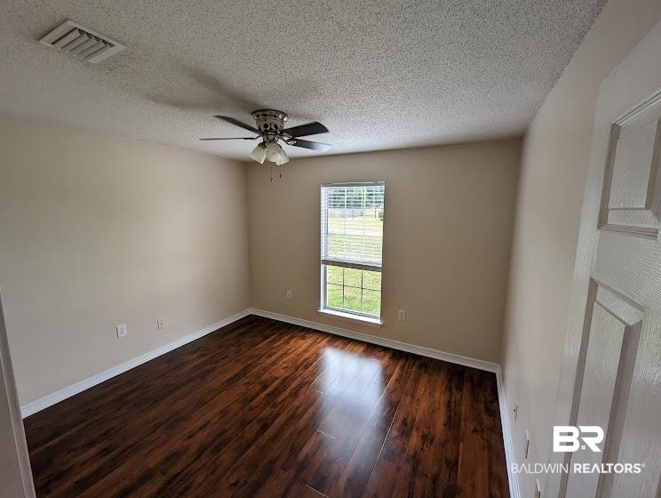 12971 Labradors Run Foley, AL 36535 - Photo 9 of 23 Bright interior space featuring wood-finish flooring, neutral-toned walls, a ceiling fan with integrated lighting, and a window with blinds