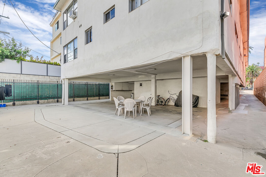 1812 North Gramercy Place, Unit 11 Los Angeles, CA 90028 - Photo 13 of 18 a view of a house with a patio and a yard