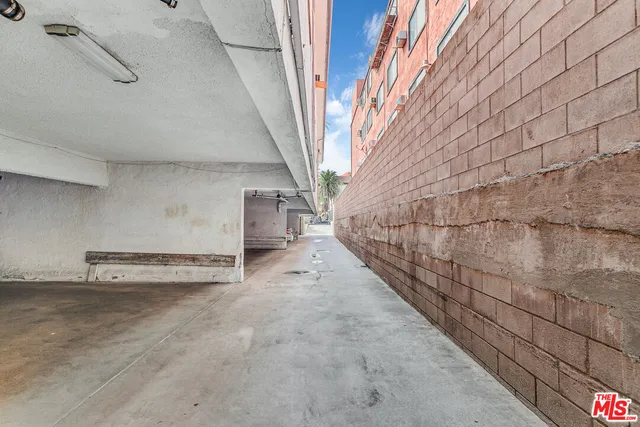 a view of a room with stairs and wooden walls