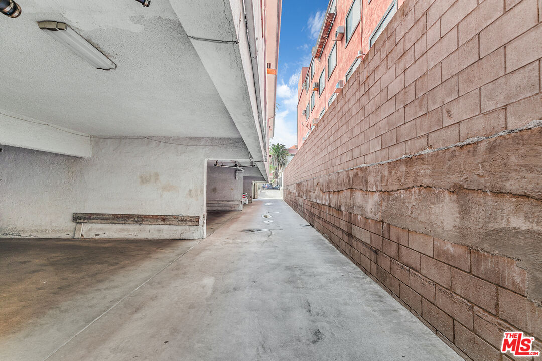1812 North Gramercy Place, Unit 11 Los Angeles, CA 90028 - Photo 16 of 18 a view of a room with stairs and wooden walls