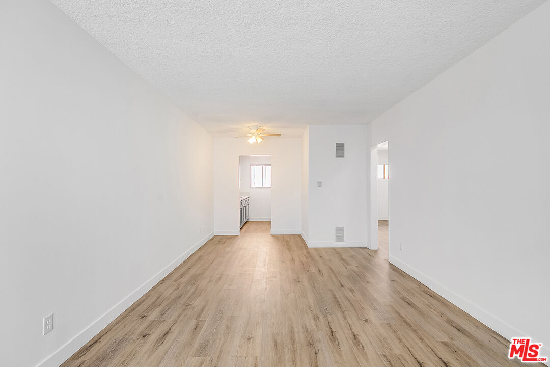 1812 North Gramercy Place, Unit 11 Los Angeles, CA 90028 - Photo 2 of 18 a view of an empty room and wooden floor