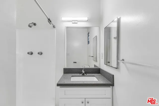 a bathroom with a sink and a mirror