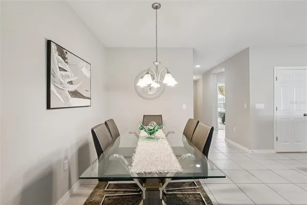 a kitchen with stainless steel appliances kitchen island granite countertop a refrigerator and a stove top oven