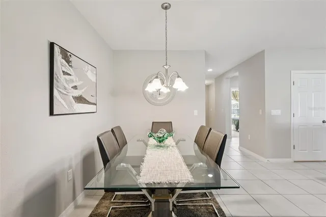 a kitchen with stainless steel appliances kitchen island granite countertop a refrigerator and a stove top oven