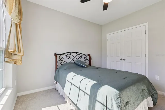 a bathroom with a sink vanity mirror and toilet