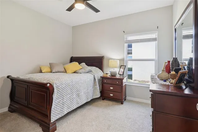 a bedroom with a bed and cabinets