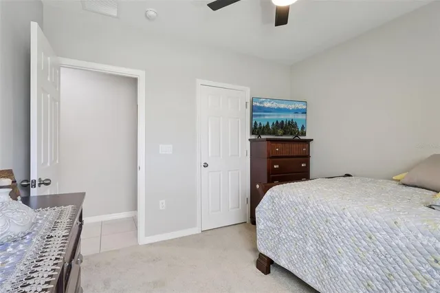 a bed room with a bed and a window