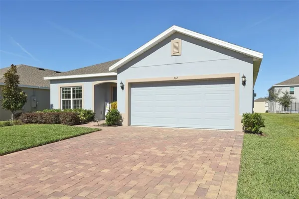 front view of a house with a potted plant