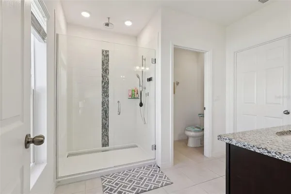 a bathroom with a sink vanity and a mirror