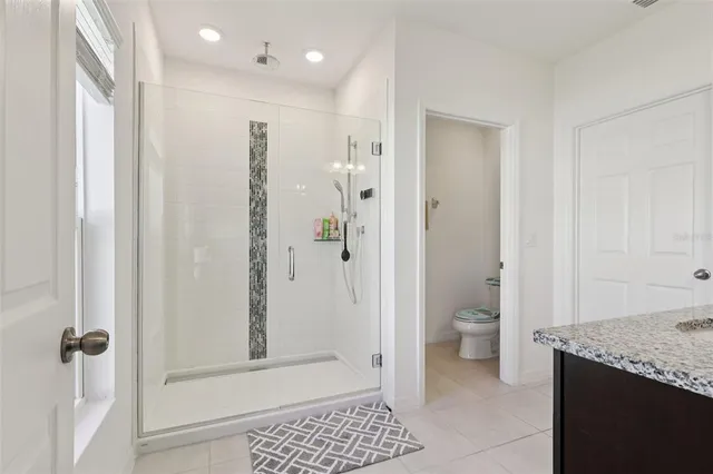 a bathroom with a sink vanity and a mirror