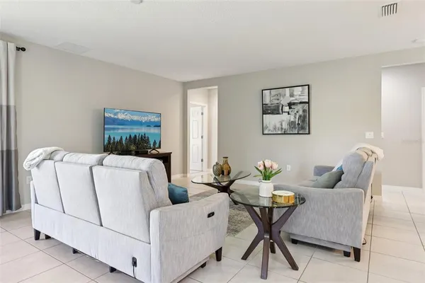 a living room with furniture and a table