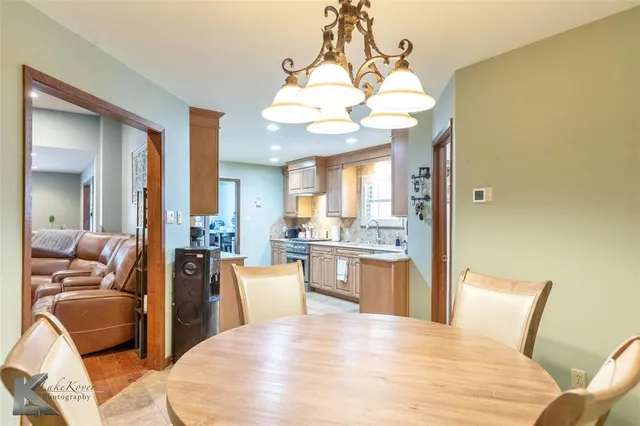 a large bedroom with a bed and furniture